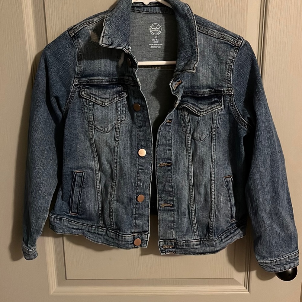 Lighter colored Jean jacket! Perfect condition, have been worn 2-4 times!